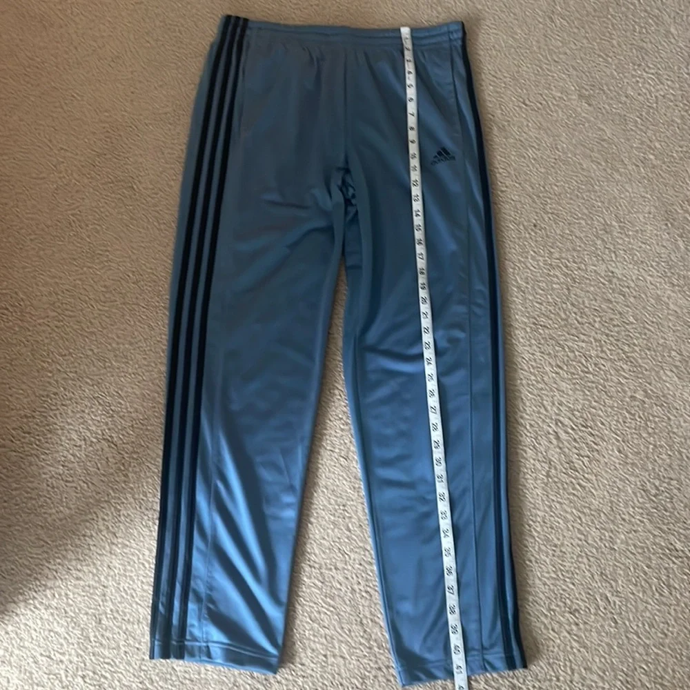 Adidas Men’s Joggers. Blue/grey color with black stripes.